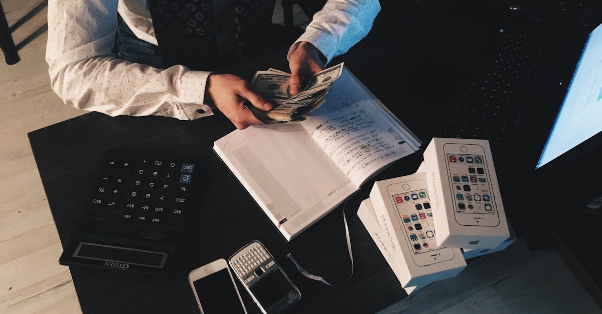 bookkeeping for nonprofits organizing finances with tech devices and cash on desk.